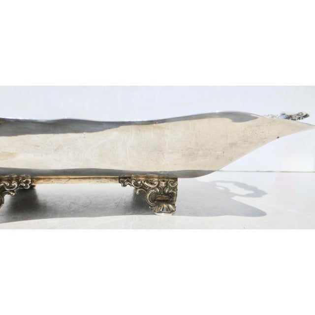 A Fine Beaux Arts serving tray with game motifs. Hunting lodge motifs for game tray. A hunter with a bow and arrow, facing...