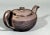 English Black Basalt Engine-Turned Teapot and Cover Circa 1790-1810 A compact and well-potted black basalt teapot of squat...
