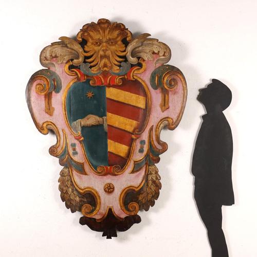 Large baroque coat of arms enclosed within a crumpled box, made of poplar painted in polychrome and partially gilded,...