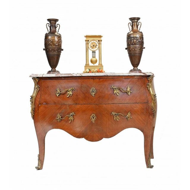 On trend vintage Louis XV French commode of bombe form Two large drawers with original ormolu fixtures Features a marble...