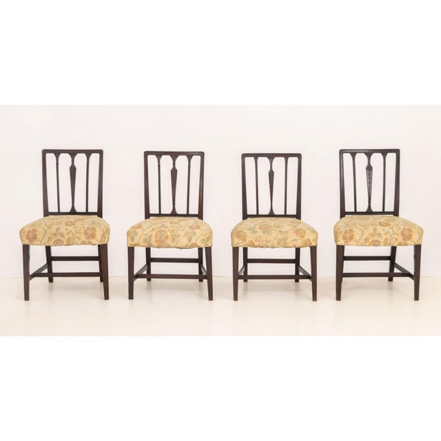 Set of Four George III Mahogany Side Chairs, with column form back slats, floral upholstered seats on four legs conjoined...