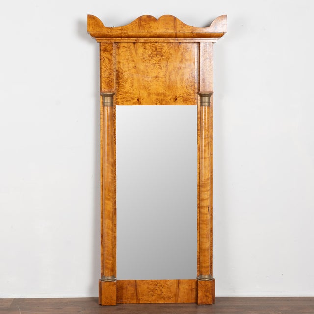 19th-century Biedermeier mirror crafted in birch veneer with refined half-column details accented in bronze-painted...