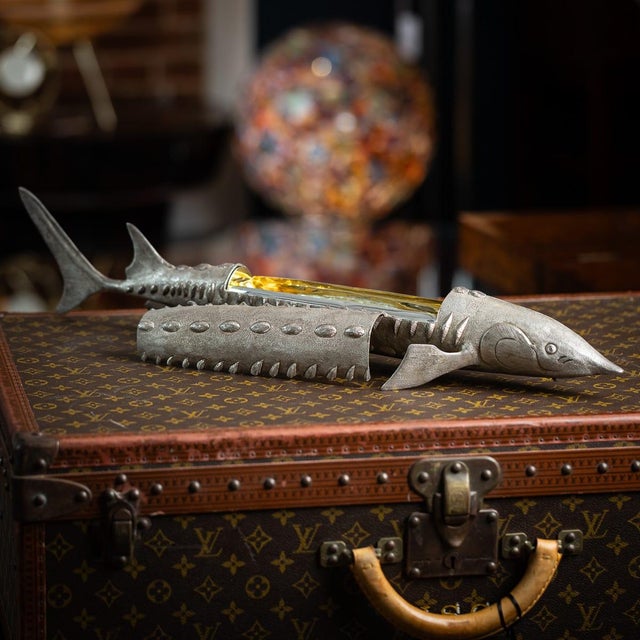 A rare 20th century english solid silver caviar server by asprey & co, london. Expertly modelled as a sturgeon, the fish...