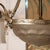 A glass piece with a design consisting of a central bowl and three arms extending from it. Both the bowl and the shades on...