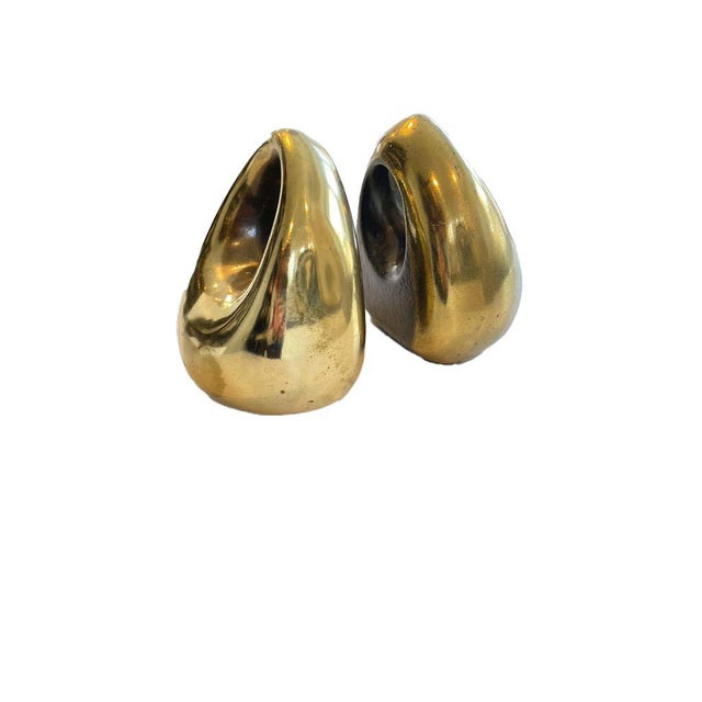 Beautiful vintage metal cast brass covered bookends designed by Ben Seibel for Jenfred Ware in the early 1960's. Sold by...