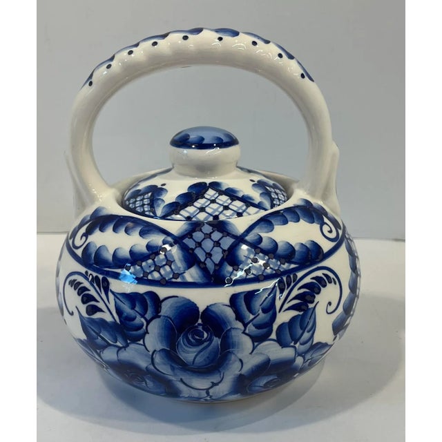 Nice vintage spoutless tea pot. Signed on bottom.