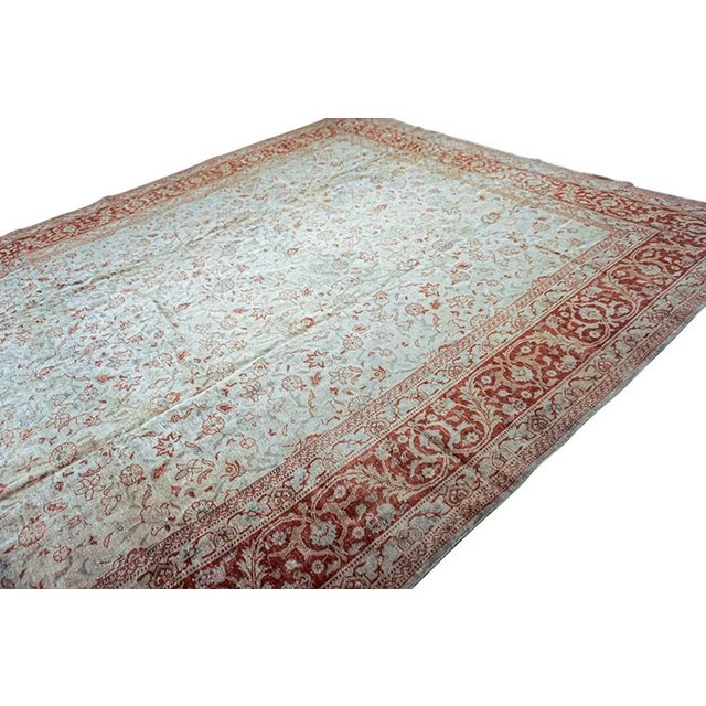 An exceptional antique Persian Tabriz rug, woven circa 1880 in Northwest Persia, combining the durability of fine wool...