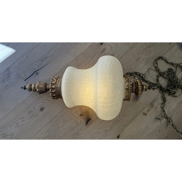 This is a truly beautiful and rare Hollywood Regency pendant light. Due to its large size and weight it would indeed be...