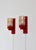 Wonderful set of Danish Modern wall lamps in red lacquered wood and amber colored glass shades. The lamps were made in the...