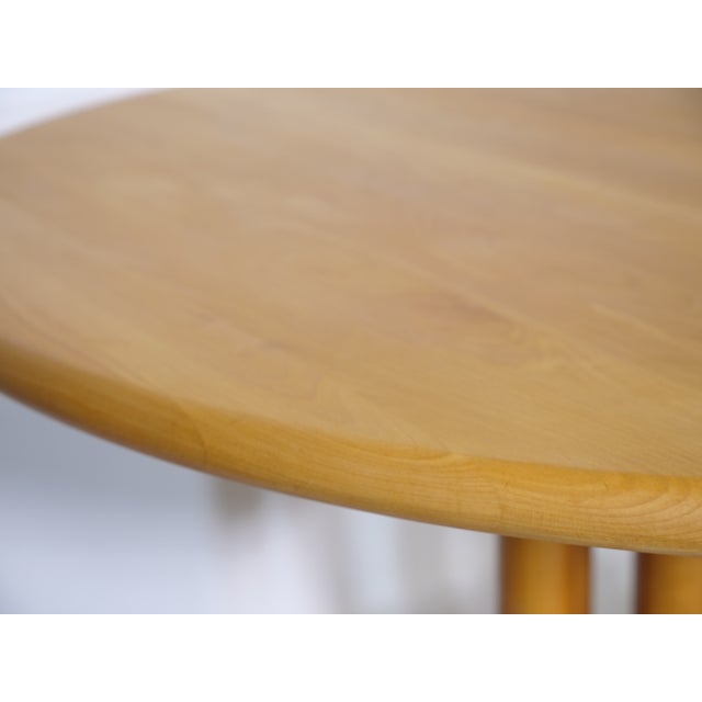 Extendable dining table made of solid alder wood, attributed to Rainer Daumiller, 1970s. The table features a rounded...