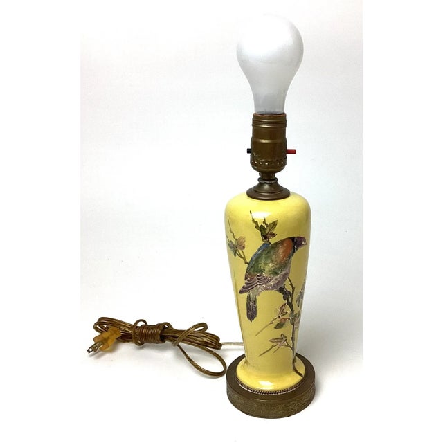 This Vintage Yellow Pottery Accent Table Lamp features a beautifully hand-painted bird with gold highlights. Standing 12”...