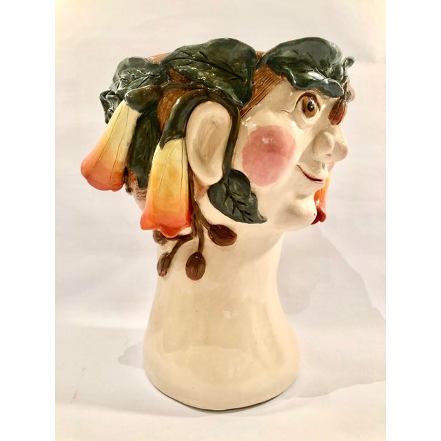"Bella" is a one of a kind, handmade, terra-cotta, thrice fired vase. She was inspired by those Jackie saw during an...