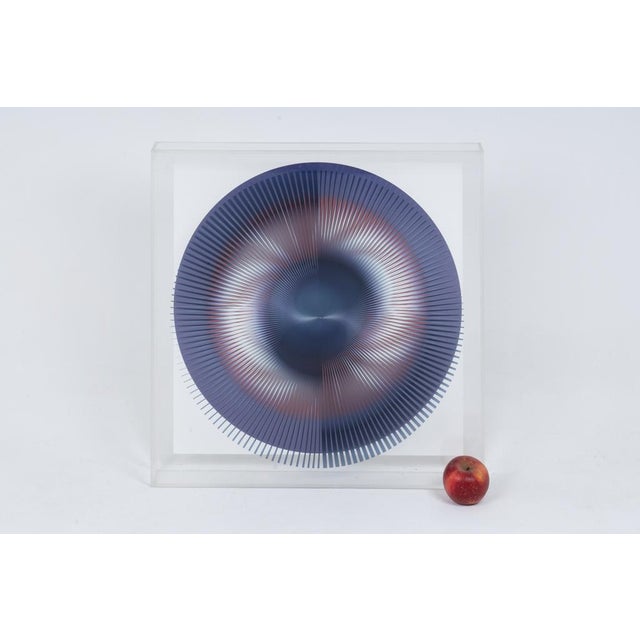 Kinetic screen print representing a purple-colored circle, square and in its acrylic glass frame. Contemporary work from...