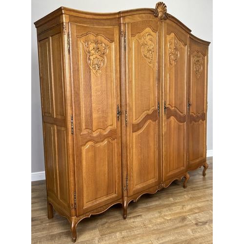 An elegant and beautifully crafted Vintage French Louis wardrobe, showcasing refined proportions and striking carved...
