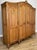 An elegant and beautifully crafted Vintage French Louis wardrobe, showcasing refined proportions and striking carved...