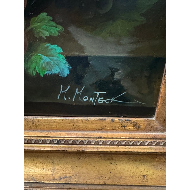 is a vintage 20th-century oil on canvas still life painting depicting flowers and fruit, often found in ornate gilt...