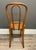 Elegant Thonet Chair with brand on underside of seat. Wooden Chair with woven seat.