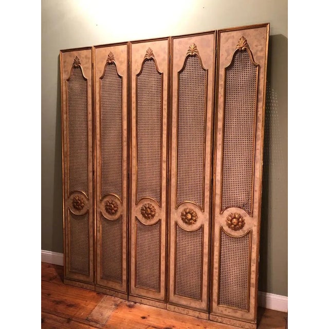 Five-paneled French gilt folding screen. Perfect for privacy or for covering up an area. Gorgeous carved wooden gilt...