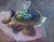 Vintage modernist, cubist influenced, stylized still life painting with of a tazza with fruit and a black bird on a table...