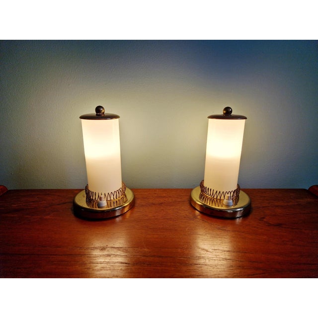 Pair of Mid-century bedside lamps in brass and cream-colored tubular opaline glass, Germany, 1950s. Simple yet elegant....