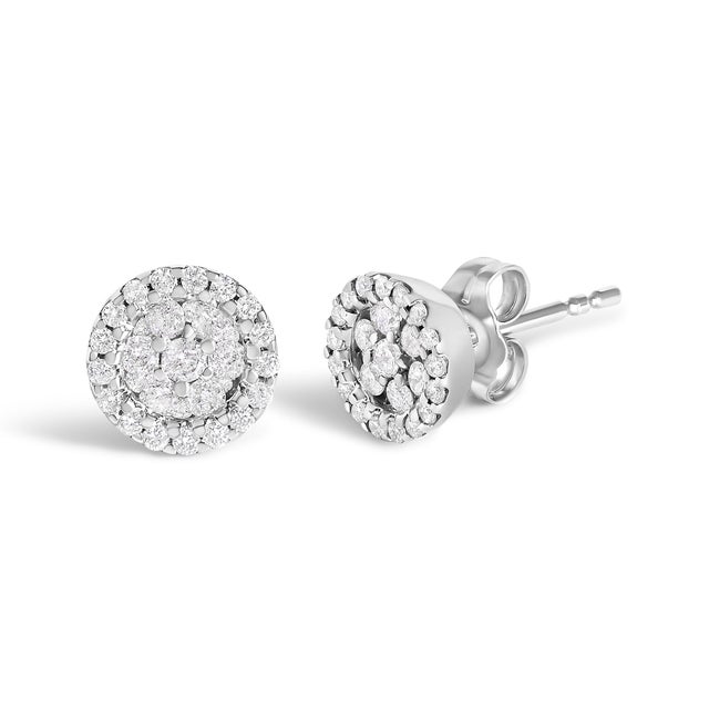 Elegant and timeless, these 14K white gold stud earrings feature round, brilliant cut diamonds in a halo style button...