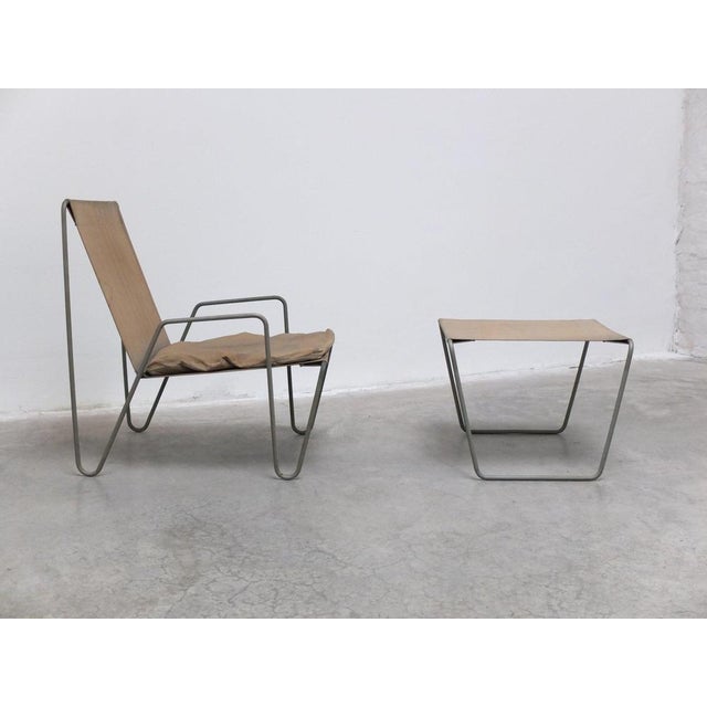 Early ‘Bachelor’ chair with a rare matching ottoman designed by Verner Panton for Fritz Hansen in 1953. Both items have...