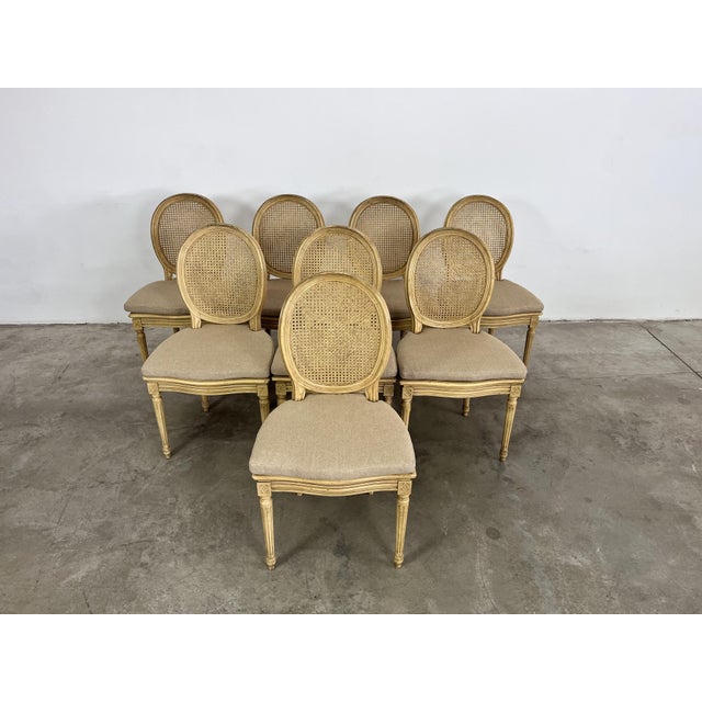 Dimensions: H 37” x W 21” x D 21.5” x SH 20” Set of 8 Vintage French Medallion cane back dining chairs. Each chair has a...