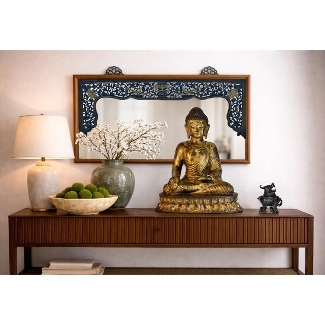 A beautiful solid wood mirror framed with a fine 19th century carving. The elaborate design prominently features a...
