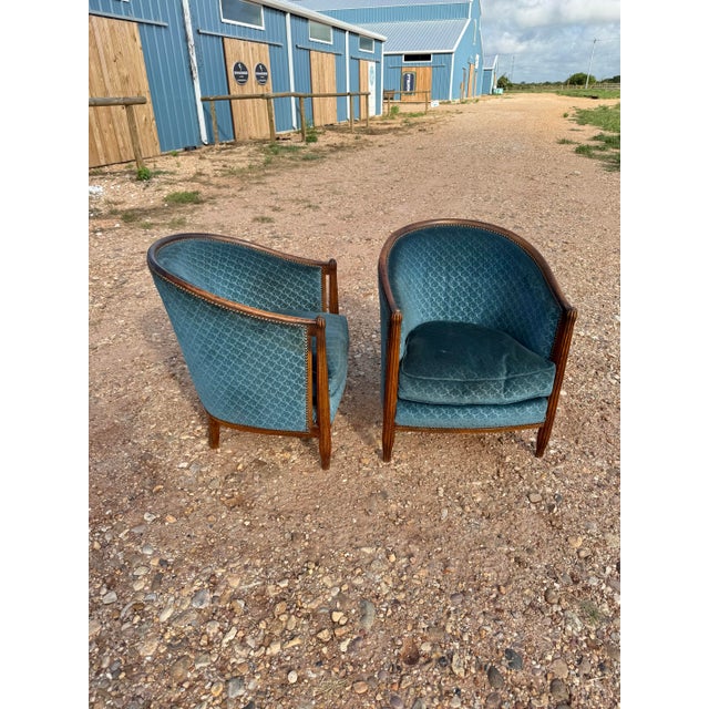 Classic pair of French Art Deco Solid Mahogany Barrel Back Club Chairs. The wood has been finished with a lustrous French...