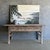 This charming vintage elm wood console is a one-of-a-kind piece with beautiful age and patina that adds character to any...
