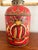 Fun red tole lamp with hand painted black and gold decoration. Includes the black paper shade. Measures 9” wide, 18 1/2"”...