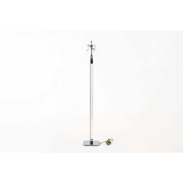This vintage mid century modern glass column and chrome base floor lamp designed by Stewart Ross James for Hansen Lighting...