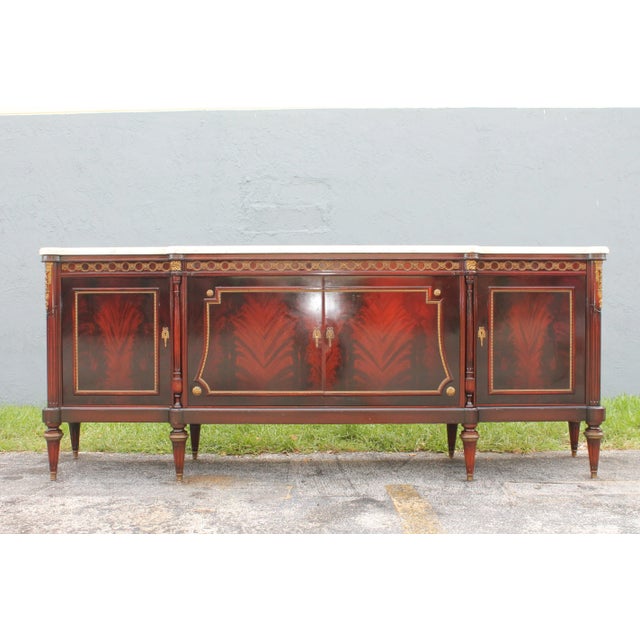A French 1920's neoclassic style long Buffet/ Sideboard. There is a bar area that lights up. This is a beautiful...