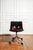 Modus office chair by Osvaldo Borsani for Tecno, Italy, 1980. Swivel office chair with a burgundy plastic shell...