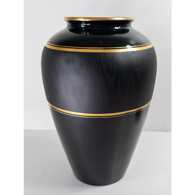 We are selling this gorgeous early 20th century Czech art glass vase. This vase has dark amber or amethyst colored glass...