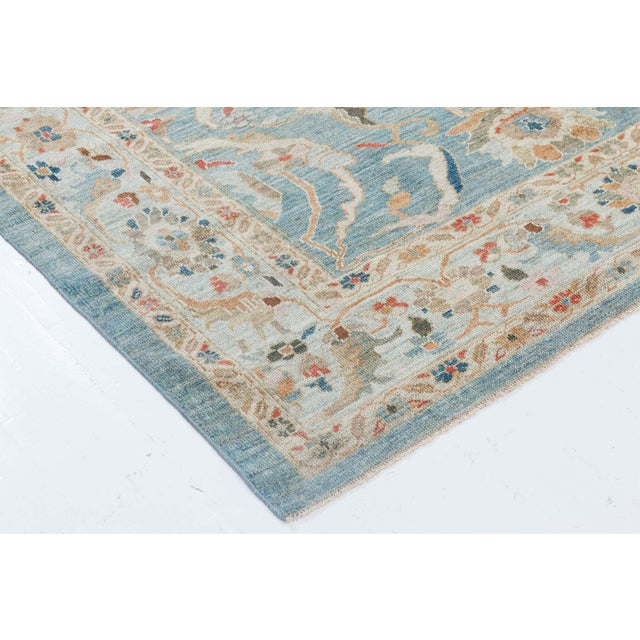 This exquisite hand-knotted wool rug draws inspiration from the esteemed Sultanabad weaving tradition, seamlessly blending...