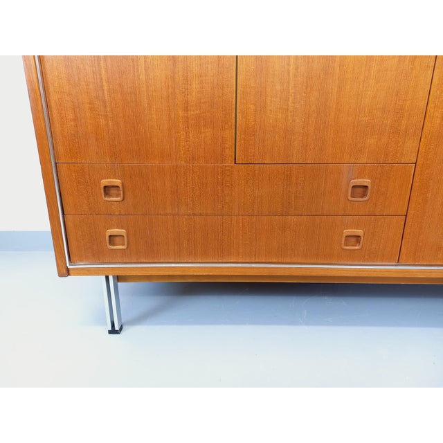 Vintage Scandinavian modernist style wardrobe from the 1960s, made of teak with chrome accents, designer chrome metal...
