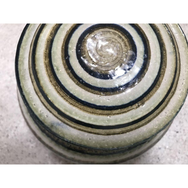 This fine ceramic bowl with lid was hand-crafted at the Søholm Stentoj workshop on the Danish island of Bornholm during...