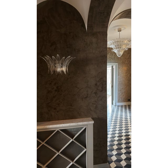 Set of 2 classic eclectic murano wall sconce where each lamp consists of nine feather formed glass prisms in clear glass...