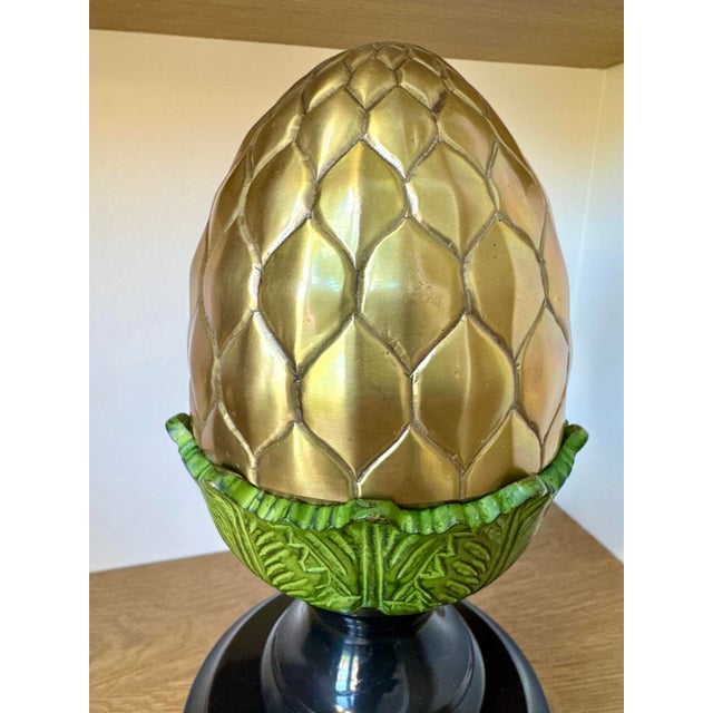 This substantial solid bronze finial features a richly textured, acanthus-inspired design and warm metallic tones....