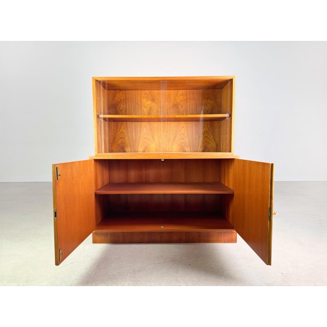 Beautiful sideboard with cupboard attachment from the 1960s. The furniture consists of two parts standing on top of each...