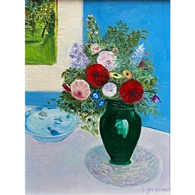 Oil painting on canvas board with zinnias, morning glories, roses, daisies and lupines in an emerald green vase, against a...