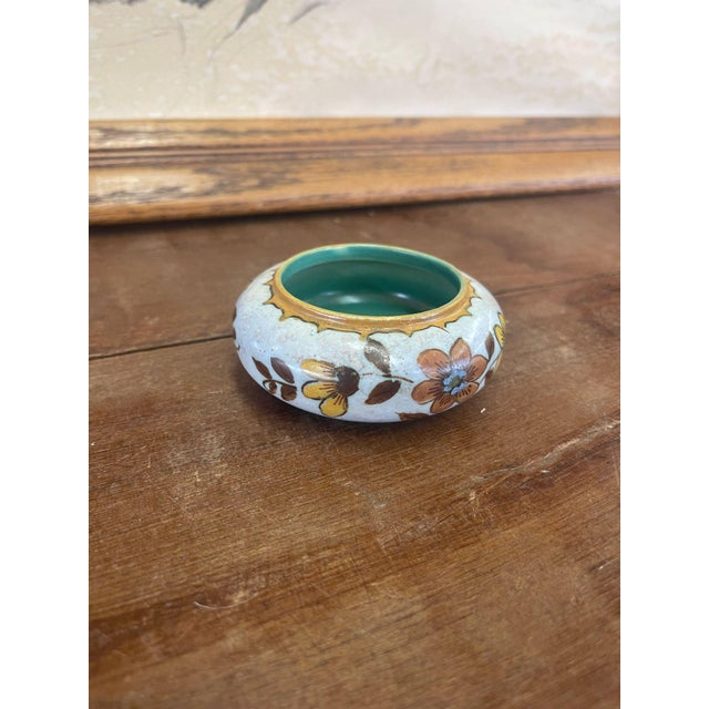 Traditional design atop this unique ceramic piece. Makers mark on the bottom, stating that was made in Holland. Circa...