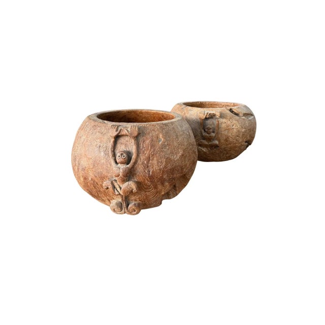 This striking set of hand-carved teak bowls is crafted from solid blocks of burl wood, a material highly prized for its...