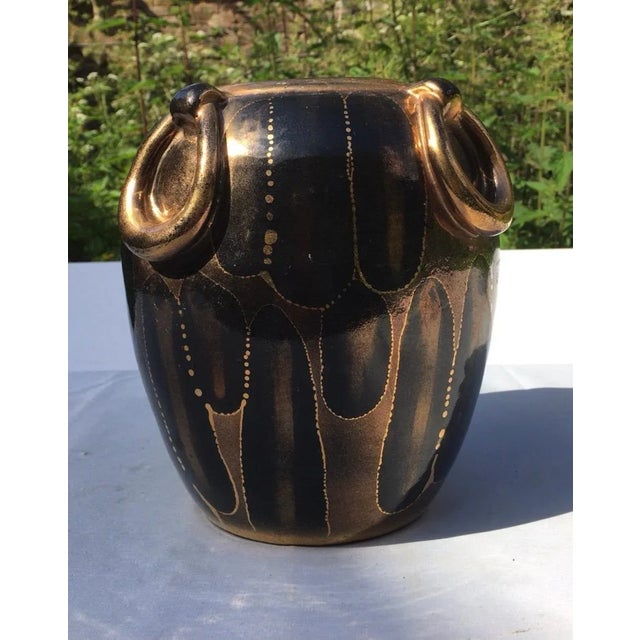 An exceptional Art Deco vase signed Louis Dage. Gold border and large gold ring.