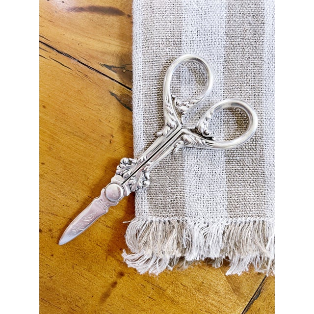A beautiful pair of antique circa late 1800s solid sterling silver grape shears made by Tiffany & Co. Excellent condition,...