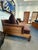 Christian Liaigre “Opium” Daybed, circa 2000. Dark stained wood frame with woven cane detail and upholstered cushions. A...