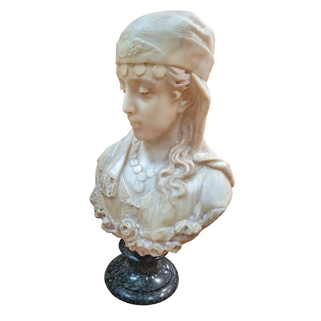 On offer is a 19th-century Italian Orientalist alabaster bust of a woman with a serene, downcast gaze, a coin necklace,...
