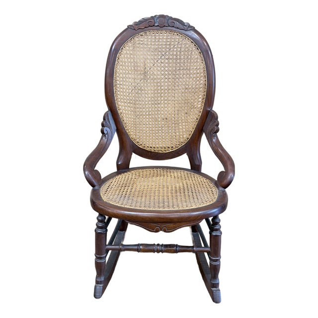 Vintage Victorian Mahogany Cane Back Rocking Chair With Carved Crest For Sale