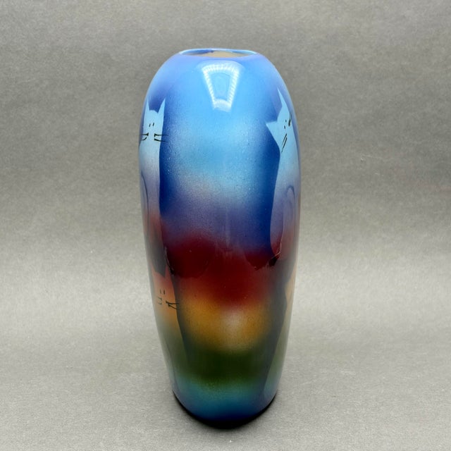 This vibrant ceramic vase by Judith Stiles features a whimsical design of airbrushed cats and hearts set against a...